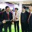 图为毛建东（右一）陪同中国老龄科学研究中心副主任党俊武（左二）一行参观国家辅助器具华中区域中心展区 - 残疾人联合会
