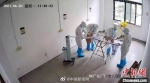 图为试卷消毒现场监控视频截图。广州市教育局供图 - 新浪湖北